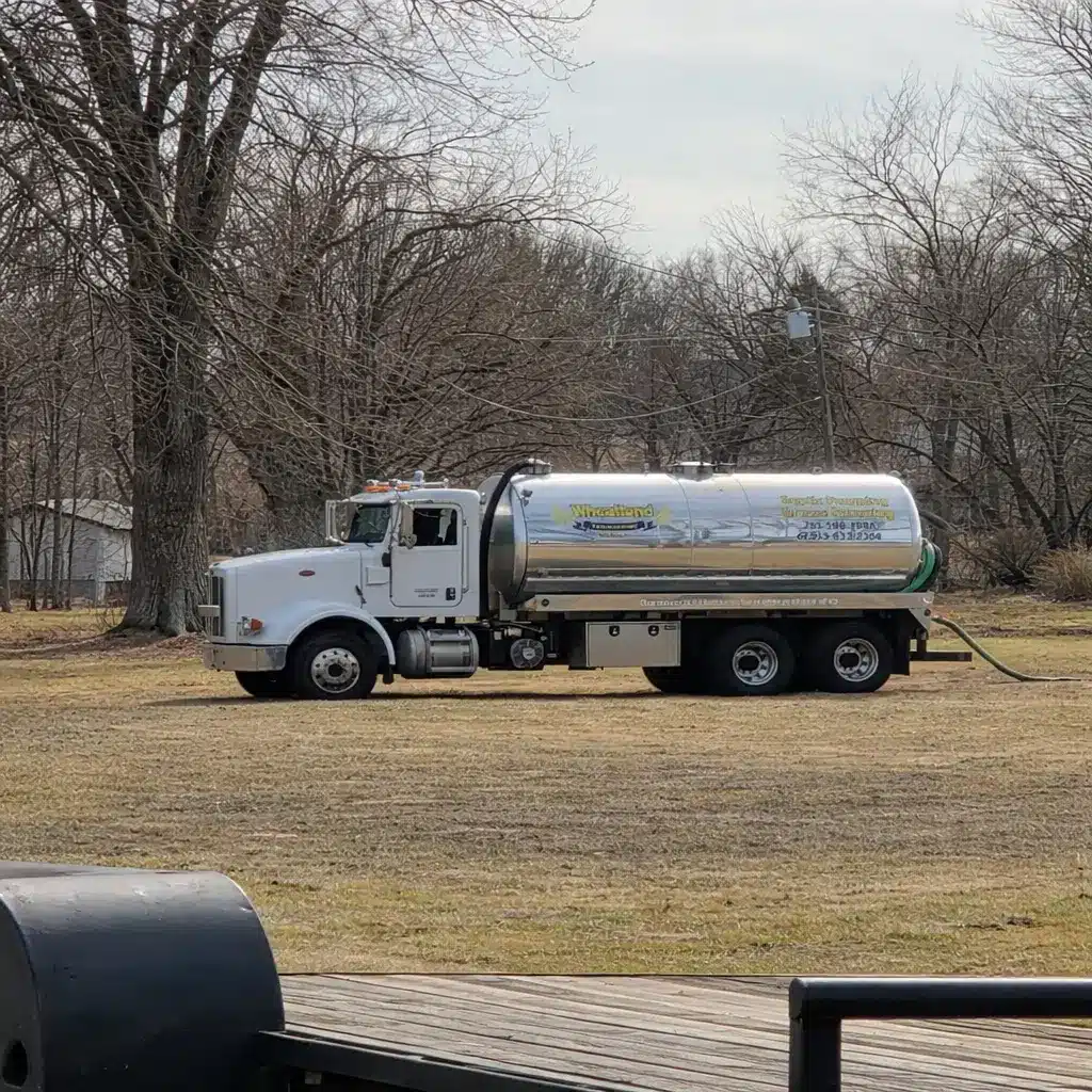 Wheatland Plumbing and Septic vacuum truck pumping a residential septic tank in Northeast Kansas