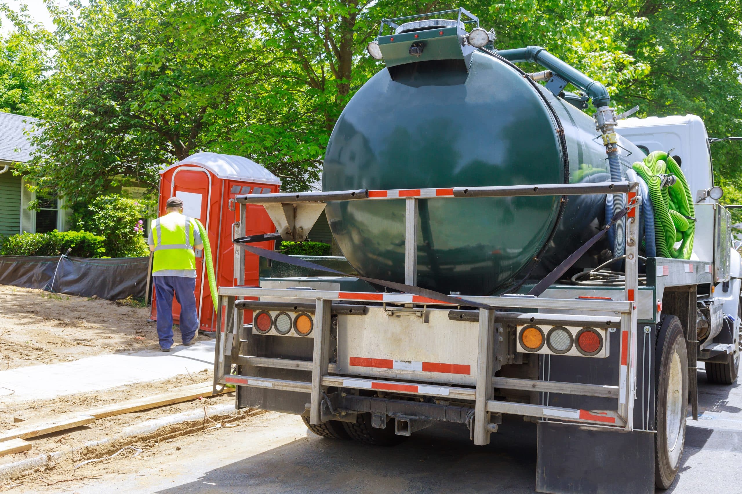Commercial septic pumping truck servicing a property in Leavenworth County